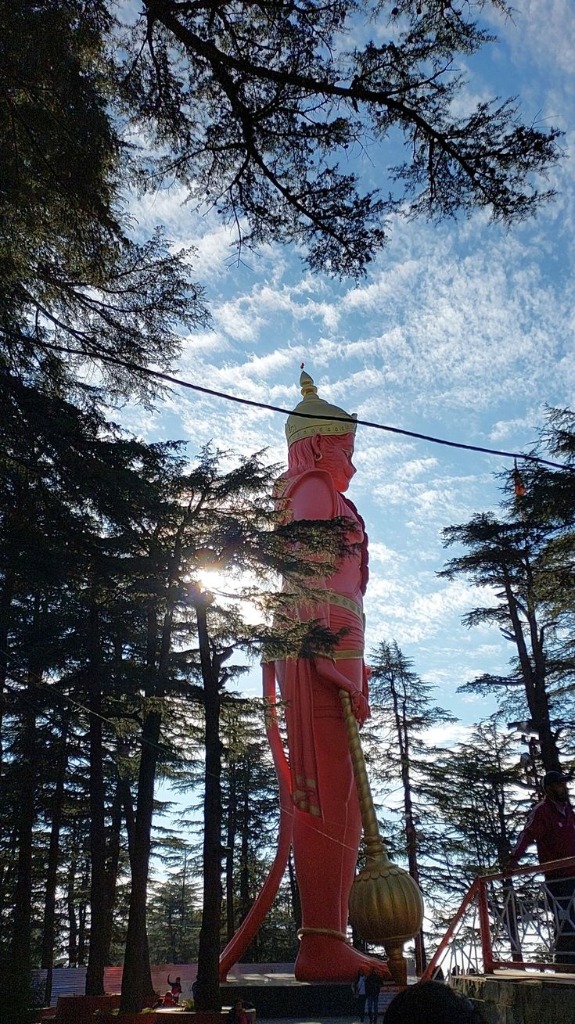 Jakhu Temple 108-feet Hanuman statue in Shimla surrounded by cedar trees